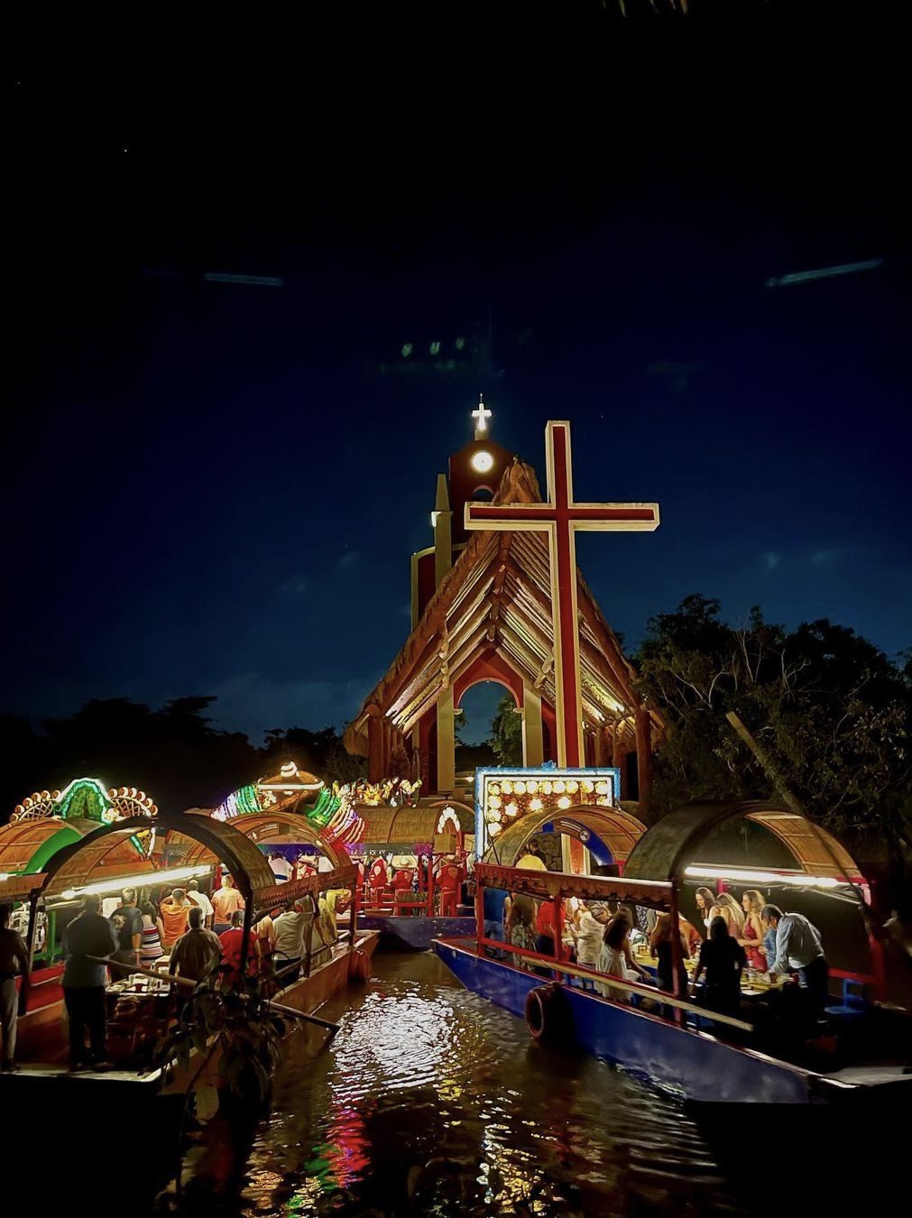 Colorful trajinera boats lined up on the canals of Xoximilco